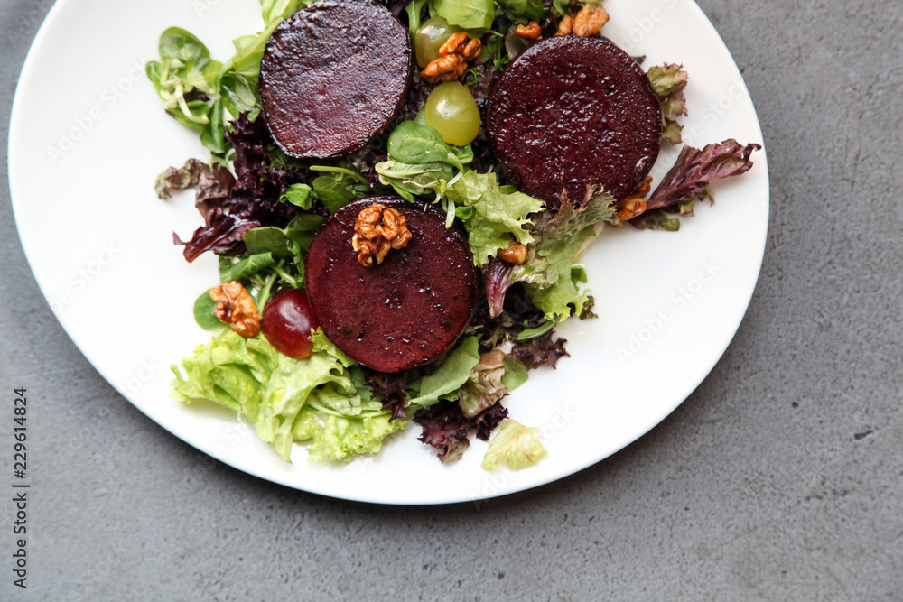 Beetroot steak salad with blue cheese sauce, grapes and walnuts Beetroot steak salad with blue cheese sauce, grapes and walnuts