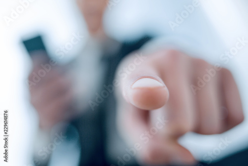 businessman pointing his finger at the camera