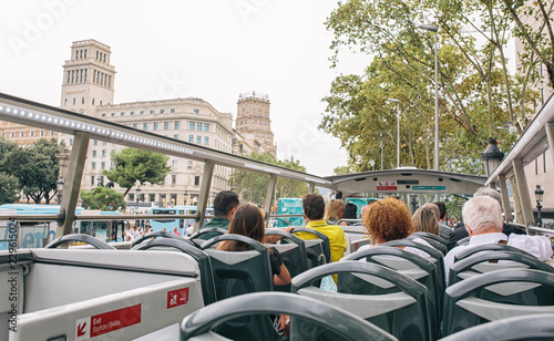 Tourists in a tourist bus on a sightseeing tour in Barcelone photo