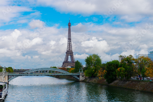 eiffel tour over Seine river with green trees, Paris, France