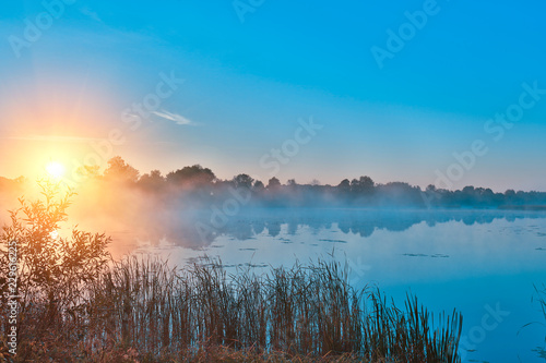 Early morning, sunrise over the lake. Rural landscape. HDR;
