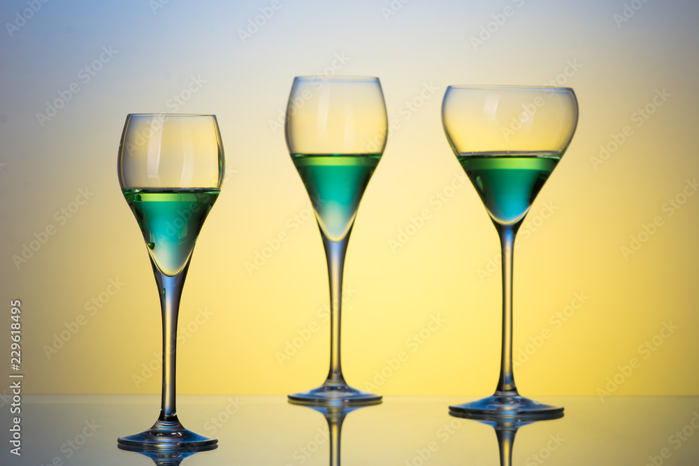 three glasses with cocktails