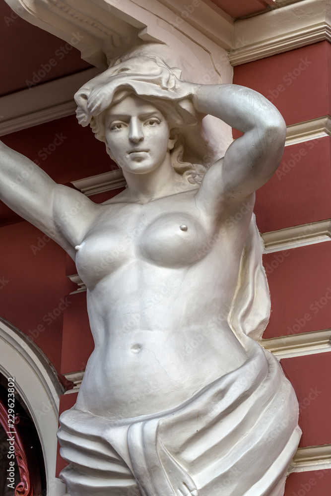 Classic white female statue of the goddess in Odessa, Ukraine