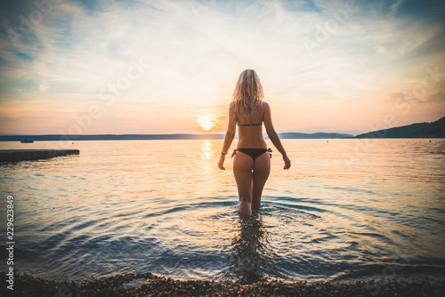 Young attractive girl model silhouette in the water © icephotography