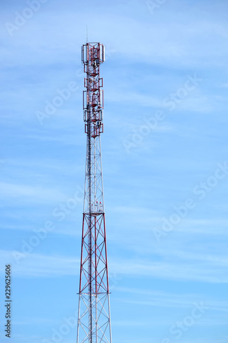 Top section of high communication tower with antennas on the top vertical photo