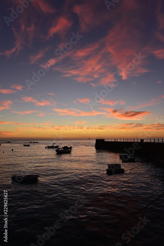 Fototapeta Naklejka Na Ścianę i Meble -  La Rocque harbour, Jersey, U.K.
Autumn sunrise and high tide.