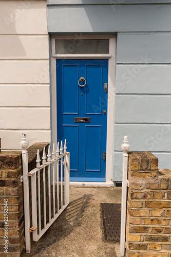 Puerta azul en casa con fachada azul. Stock Photo | Adobe Stock
