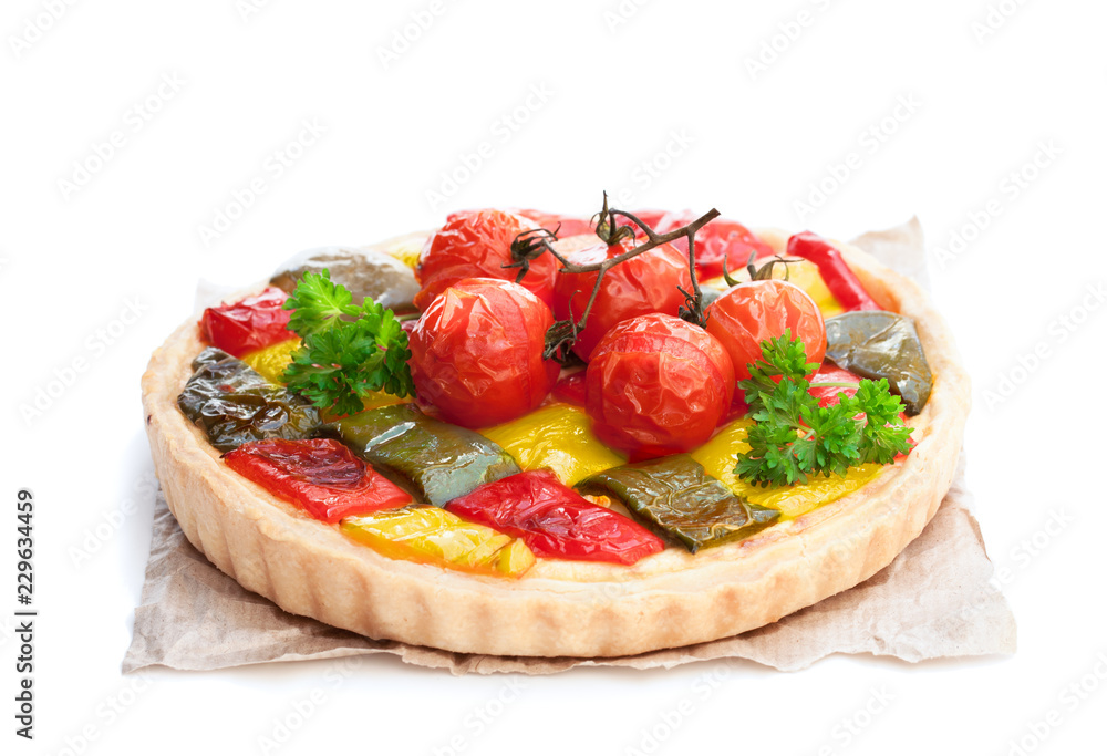 Vegetarian quiche with colored pepper and cherry tomatoes isolated on white Vegetarian quiche with colored pepper and cherry tomatoes isolated on white