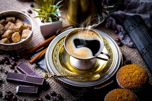 Black coffee on old background