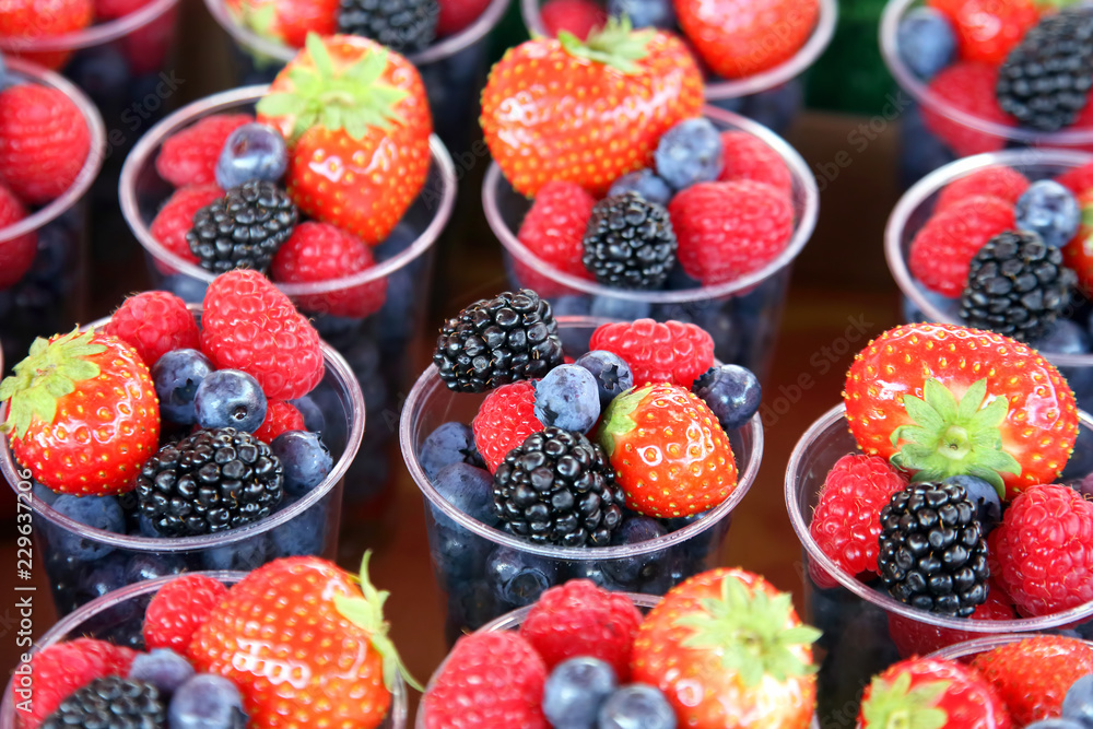 set of different berries in glasses set of different berries in glasses