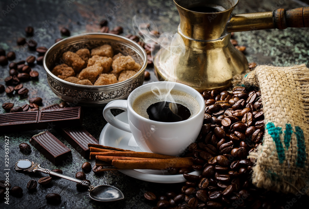 Black coffee in a cup on old background Black coffee in a cup on old background