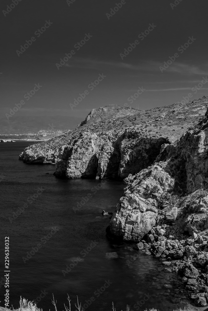 The incredible seascaping view of beach with blue sea in morocco in summer  in Al hoceima in black and white