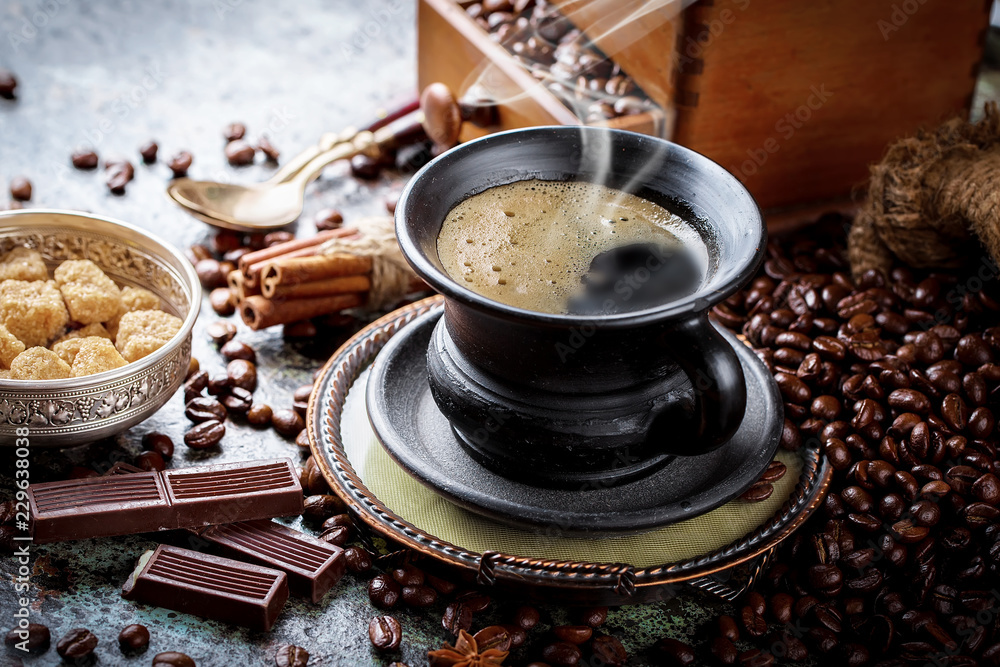 Black coffee in a cup on old background Black coffee in a cup on old background