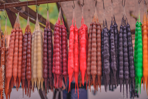 bunches of the bright fresh churchkhela hanging on the market