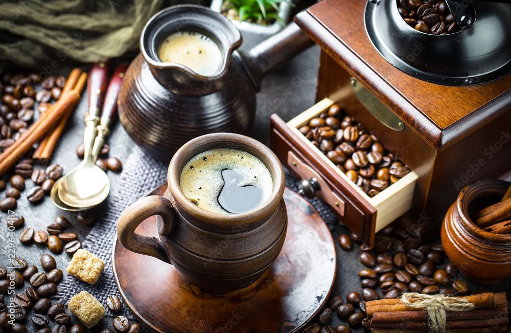 Black coffee in a cup on old background Black coffee in a cup on old background