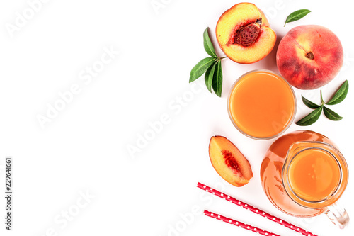 Fototapeta Naklejka Na Ścianę i Meble -  peach juice with leaves isolated on white background with copy space for your text. Top view. Flat lay pattern