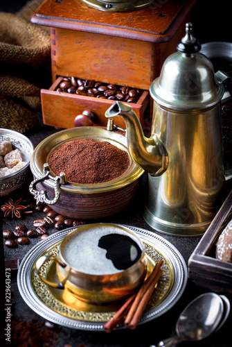 Black coffee in a cup on old background