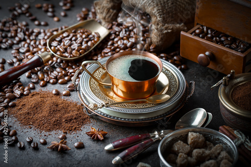 Fototapeta Naklejka Na Ścianę i Meble -  Black coffee in a cup on old background