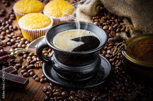 Black coffee in a composition with kitchen accessories