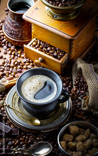 Fototapeta Naklejka Na Ścianę i Meble -  Black coffee in a cup on old background