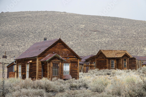 Abandoned wooden cabins slowly decay in the tough weather in Californian wild.