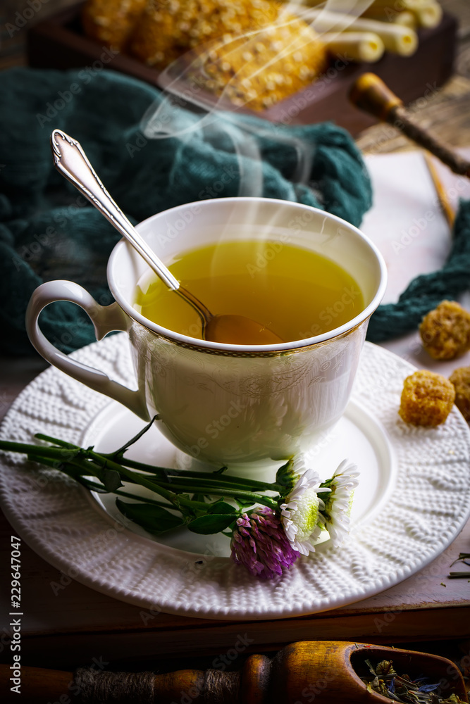 Tea in a cup on an old background Tea in a cup on an old background