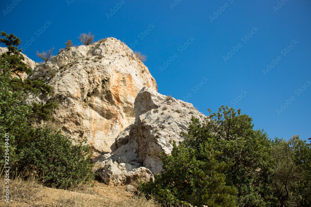 south dry rocks mountains and green plants on blue colorful sky background, good place for hiking, Greece, Thermopylae south dry rocks mountains and green plants on blue colorful sky background, good place for hiking, Greece, Thermopylae