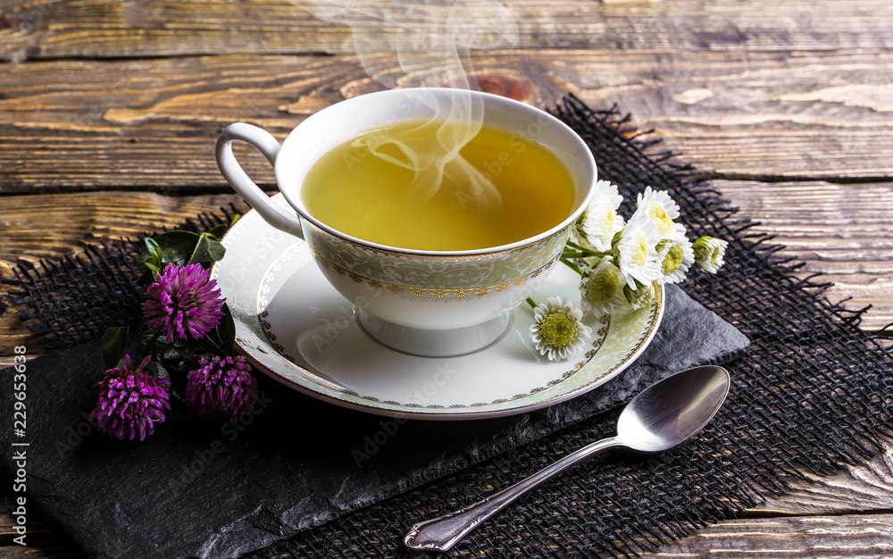 Tea in a cup on an old background Tea in a cup on an old background