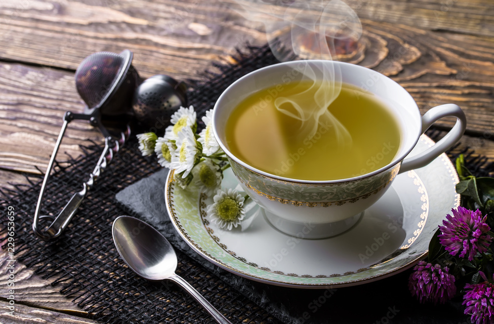 Tea on an old background, in a composition with accessories on the table Tea on an old background, in a composition with accessories on the table