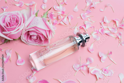 Perfume bottles on pink background