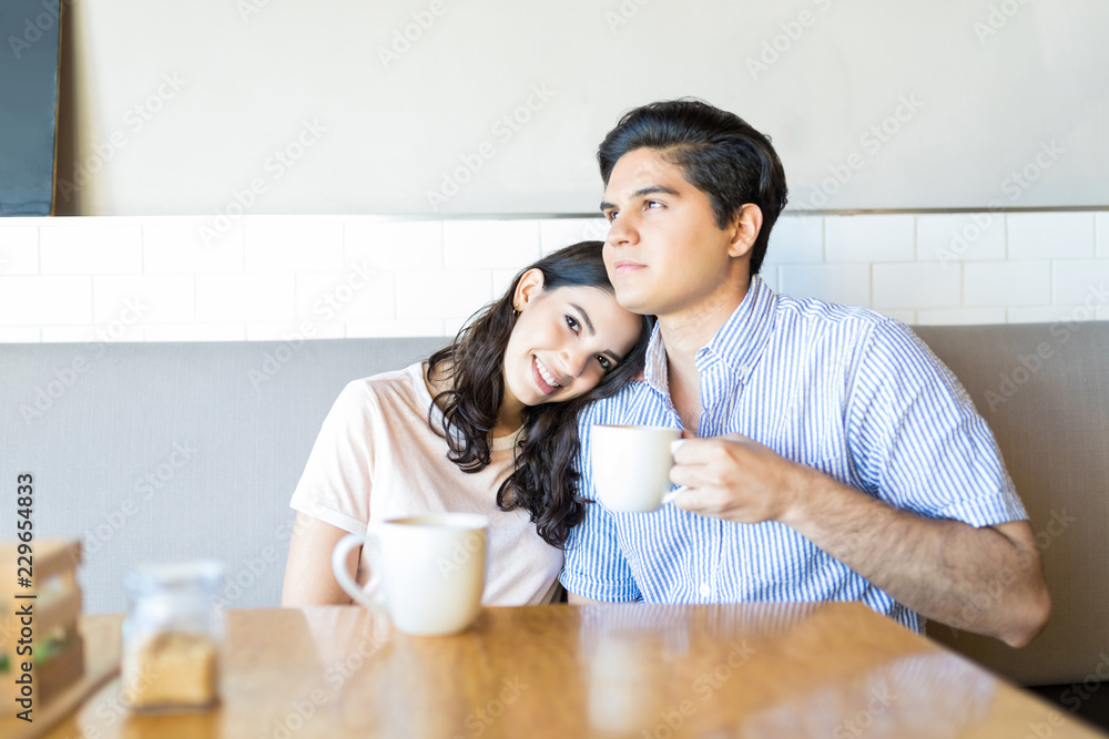 Couple Having Relaxing Time In Cafe Couple Having Relaxing Time In Cafe