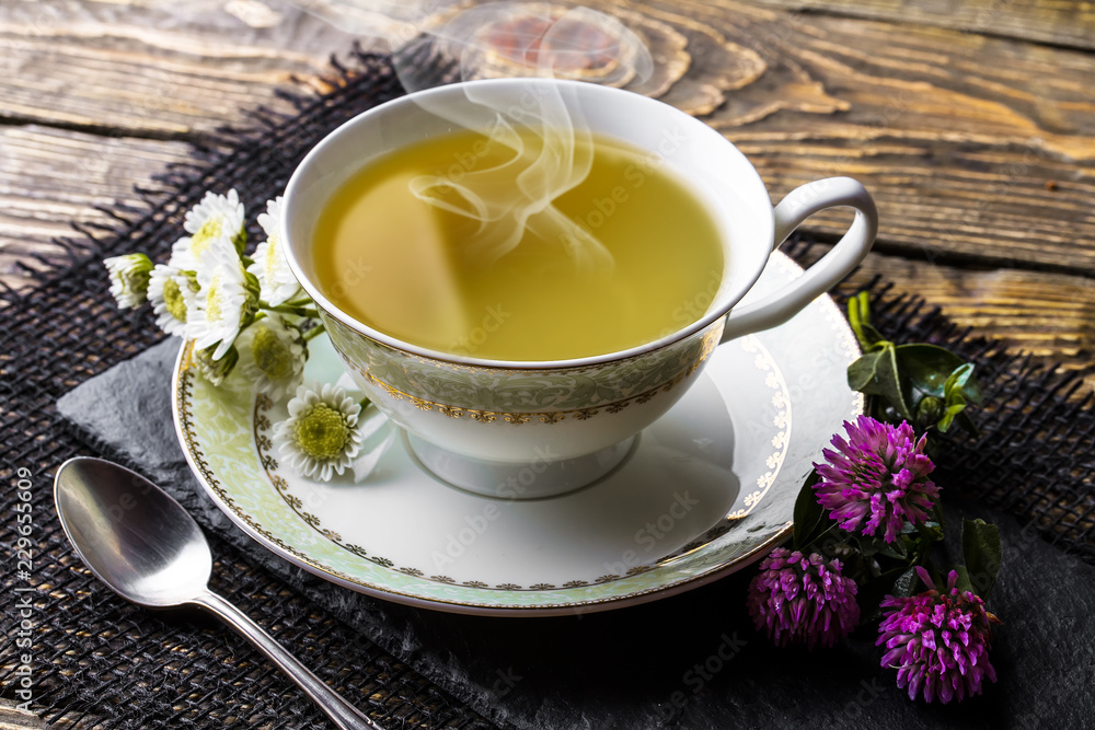 Tea in a cup on an old background Tea in a cup on an old background
