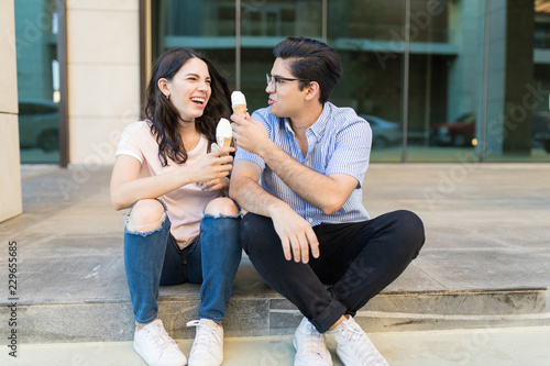 Young Couple Enjoying And Holding Frozen Food