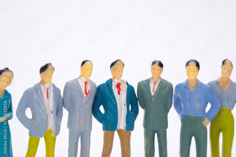 Group of figure miniature businessman or small people investor and office worker secretary on white background for money and financial business teamwork concept. Group of figure miniature businessman or small people investor and office worker secretary on white background for money and financial business teamwork concept.