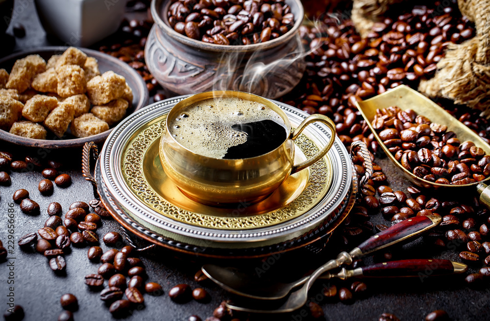 Black coffee in a cup on old background Black coffee in a cup on old background