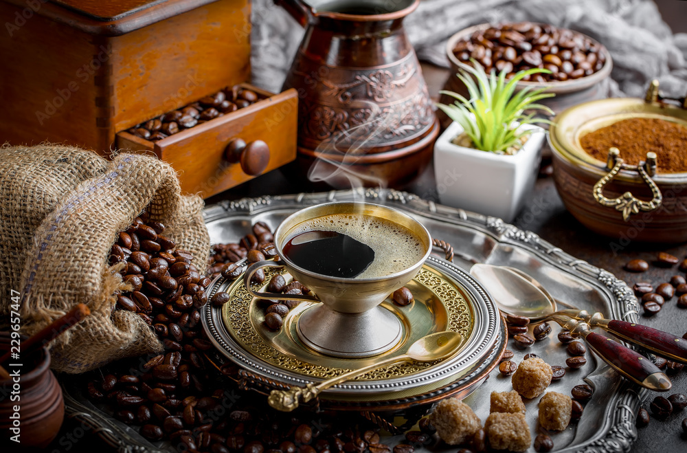 Fototapeta premium Black coffee in a cup on old background