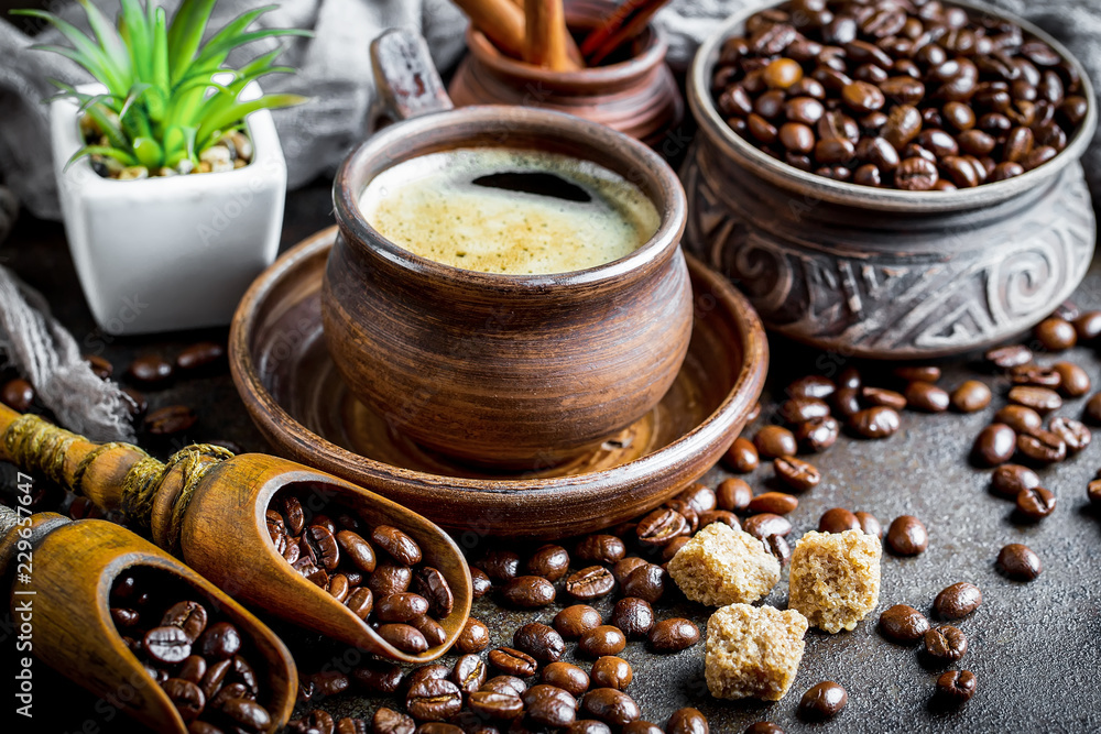 Black coffee in a cup on old background Black coffee in a cup on old background