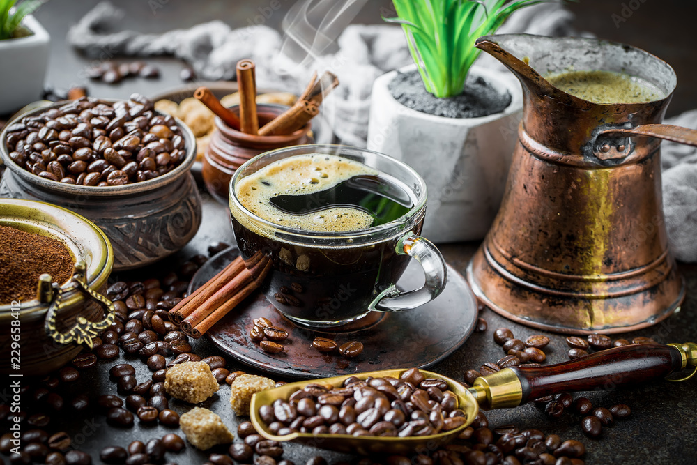 Black coffee in a cup on old background Black coffee in a cup on old background
