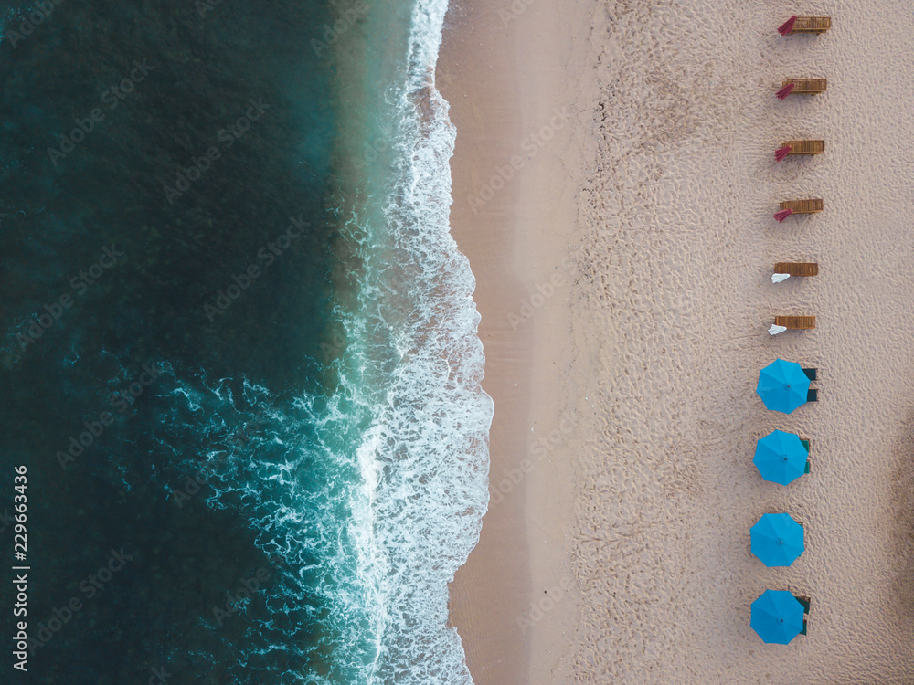 Indonesia, Bali, Aerial view of Balangan beach, empty sun loungers Indonesia, Bali, Aerial view of Balangan beach, empty sun loungers