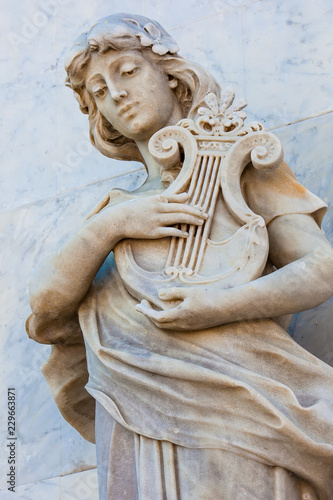 Terpsichore muse statue at the facade of the Adolfo Mejia theater in Cartagena de Indias photo