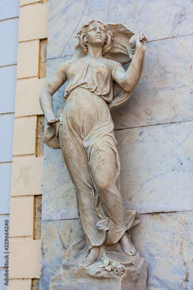 Obraz premium Polyhymnia muse statue at the facade of the Adolfo Mejia theater in Cartagena de Indias