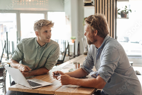 Business partners having a meeting in their new start-up company photo