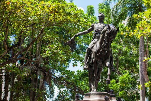 Simon Bolivar statue located at the Bolivar park in the walled city in Cartagena de Indias photo