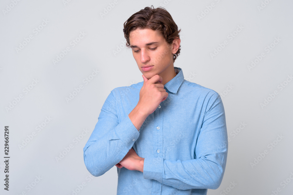Portrait of young handsome businessman with wavy hair Portrait of young handsome businessman with wavy hair