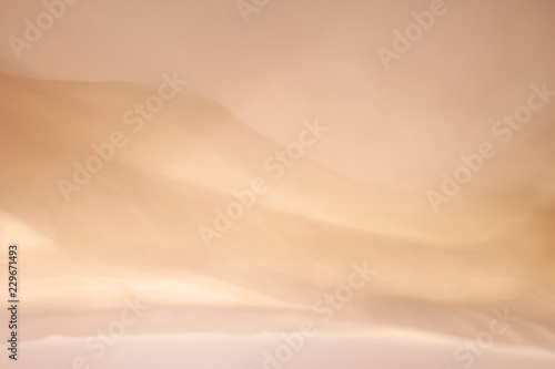 Abstract bright colorful fabric background in the form of a wave