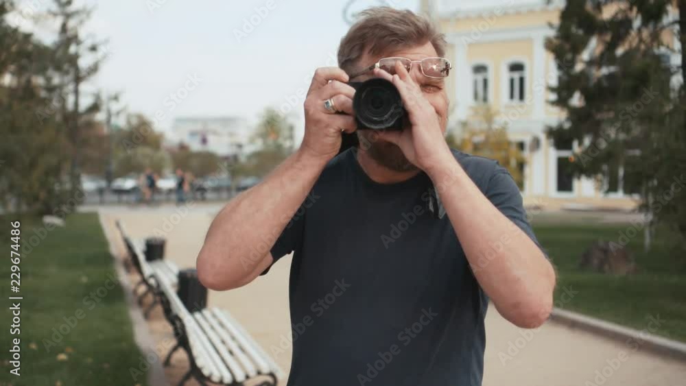 Traveling adult man take a picture in front of the camera. Traveling adult man take a picture in front of the camera.