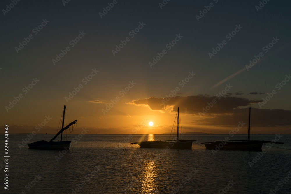 Three Boats Silhouetted by the Sunrise in Mozambique, Africa