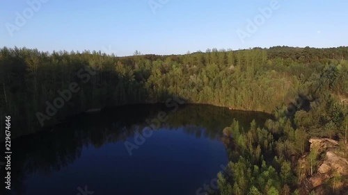 Drone fly over a Lake in the Woods/Forest photo