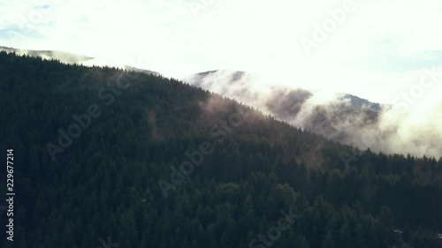 Aerial Drone Shot Slowing Panning Down to Reveal the Magnificence of the Romanian Mountains in Valea Draganului. photo