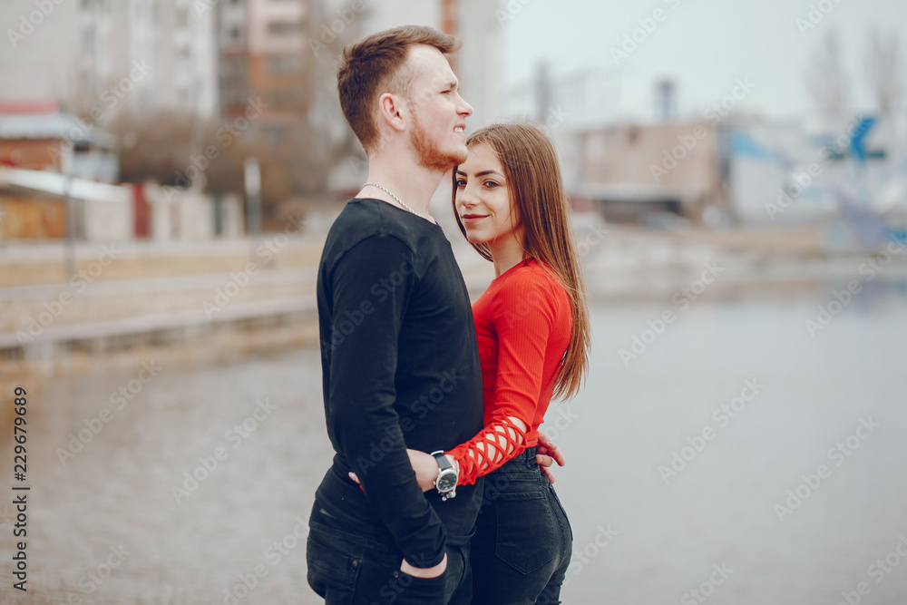 Loving couple walking around the river.